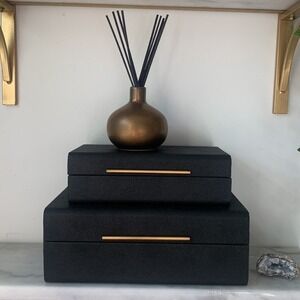 Set of two MCM storage boxes black gold‎ textured